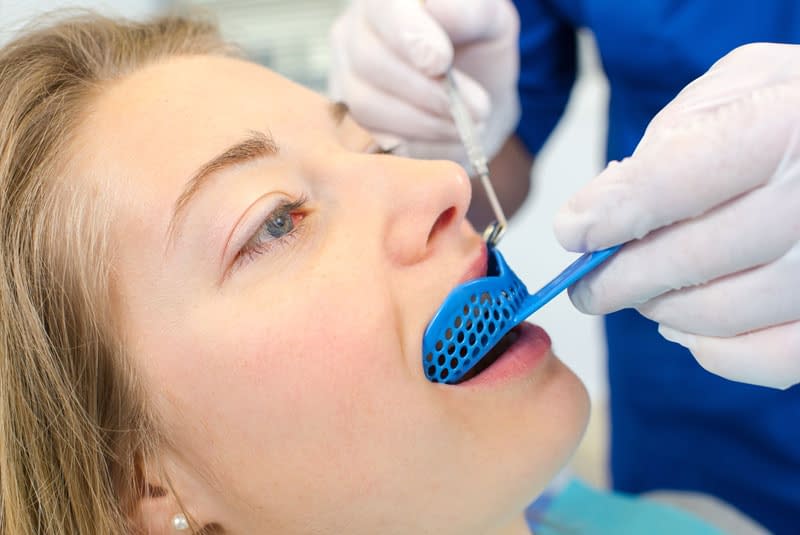 dental patient undergoing teeth grinding treatment