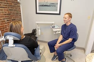 doctor and patient talking about invisalign treatment